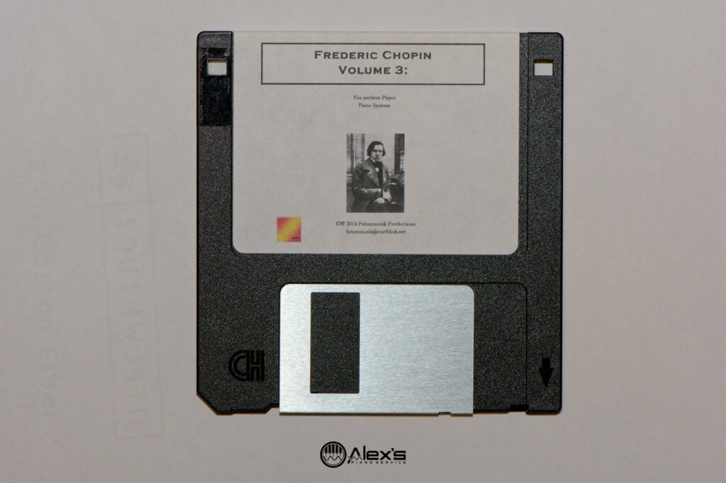 Closeup of DS/DD floppy disk with scotch tape over indicator hole.