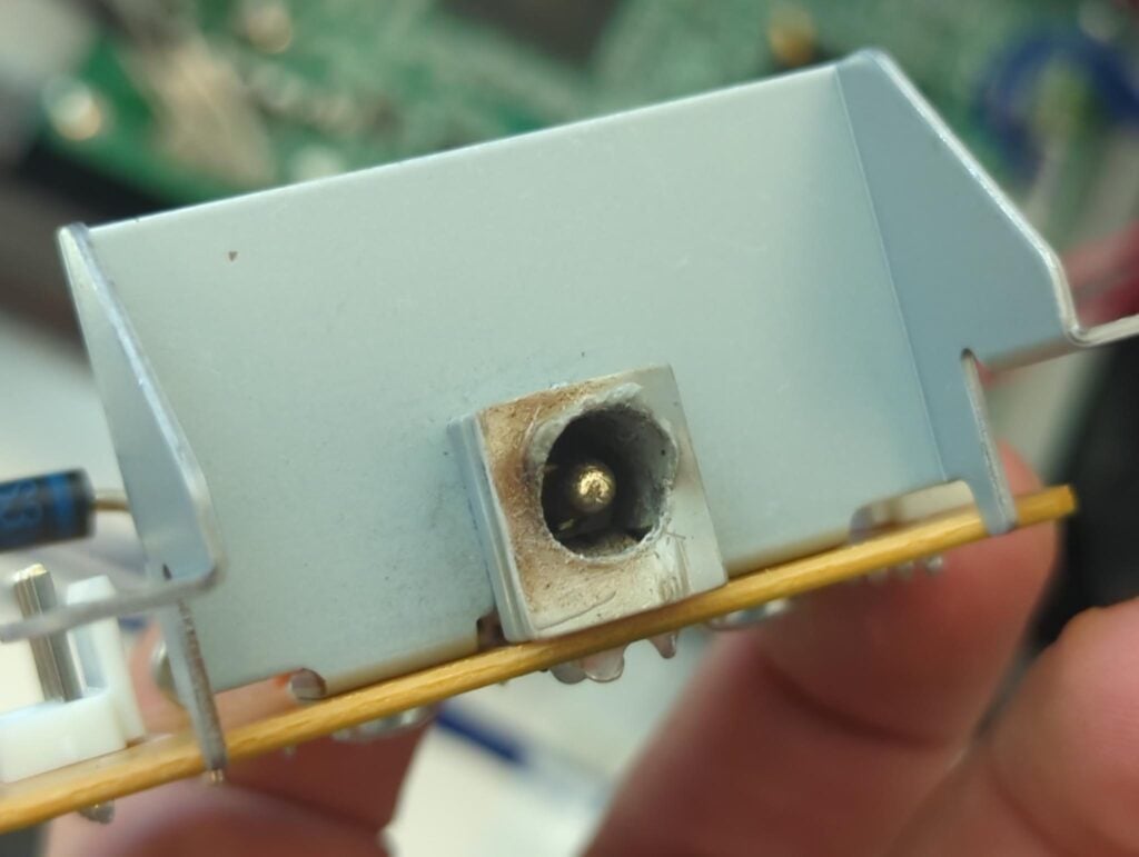 The P-155 power inlet board, with the burned power inlet (V7509100) prominently visible. It's relatively simple and easy to work on.