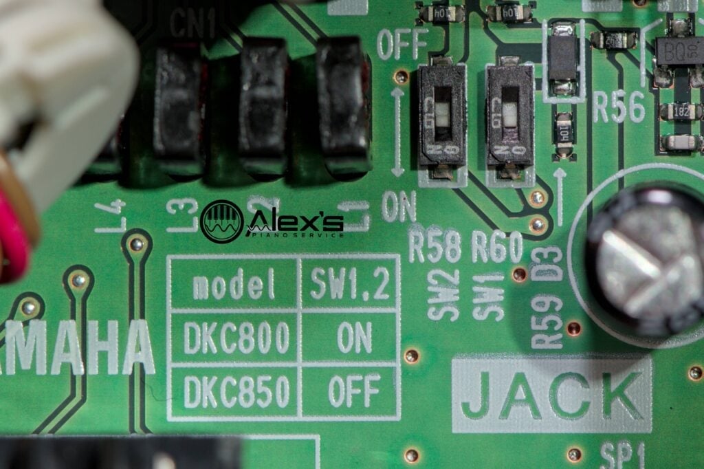 Closeup of DIP switches on SW1 and SW2 of the Jack board of a DKC-800 / DKC-850.