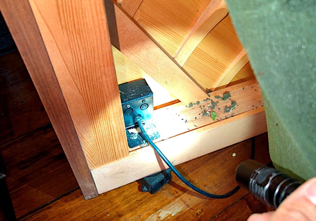 MIDI ports on the back of an MX-100II, adjacent to the power cord.