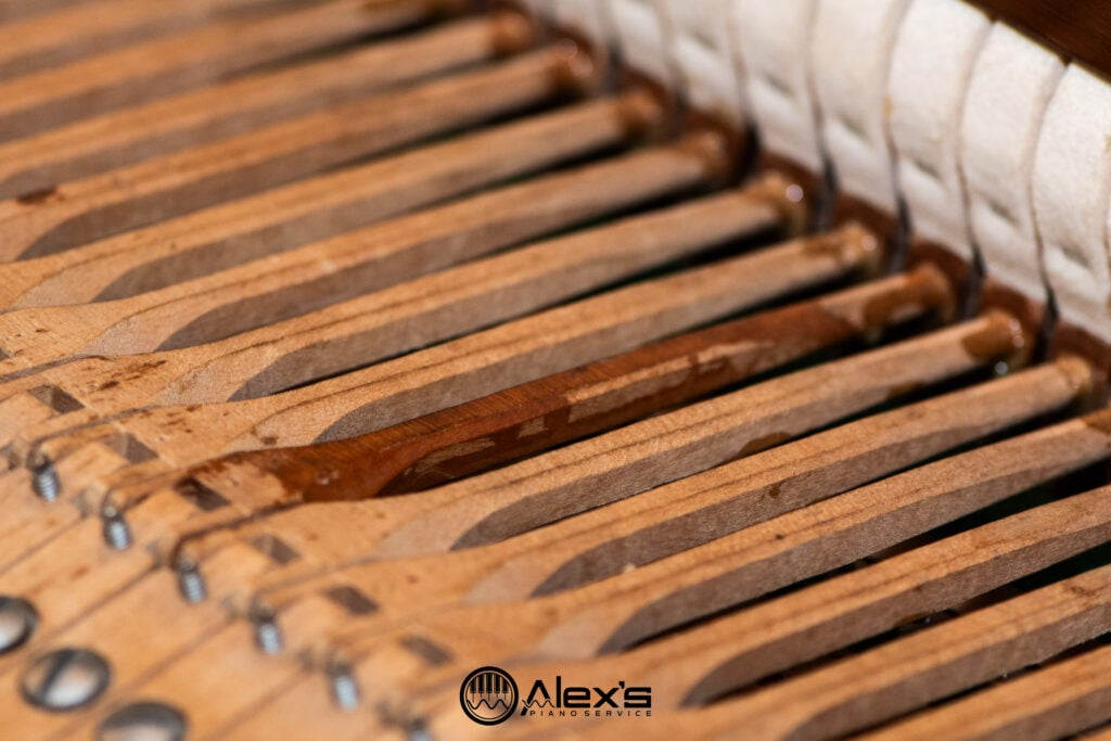 Closeup of hammers in a grand piano.
