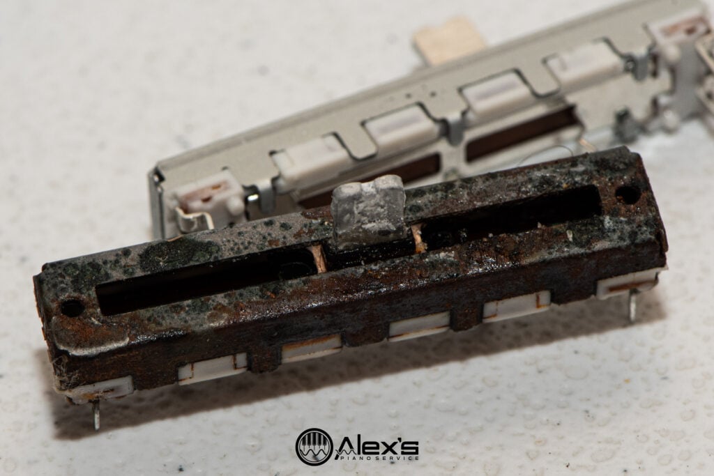 Closeup of slide potentiometers from a Yamaha P-71.