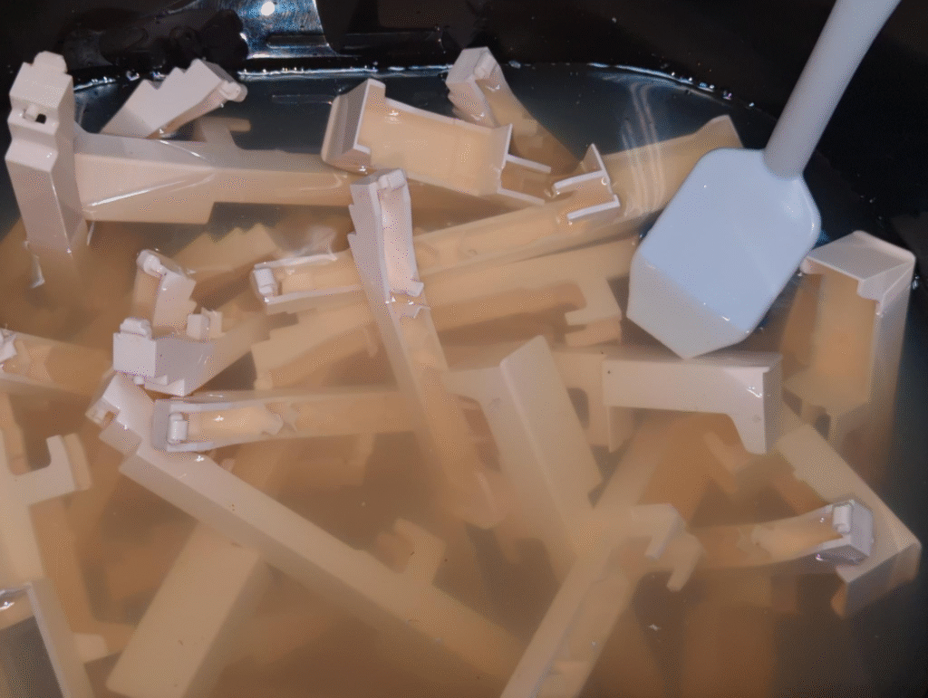 Closeup of keys in a lye bath.