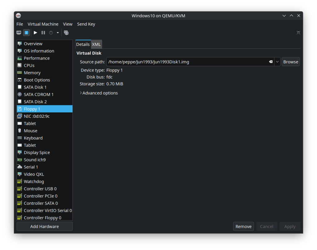 Inserting a floppy disk into a Windows 10 VM with QEMU.